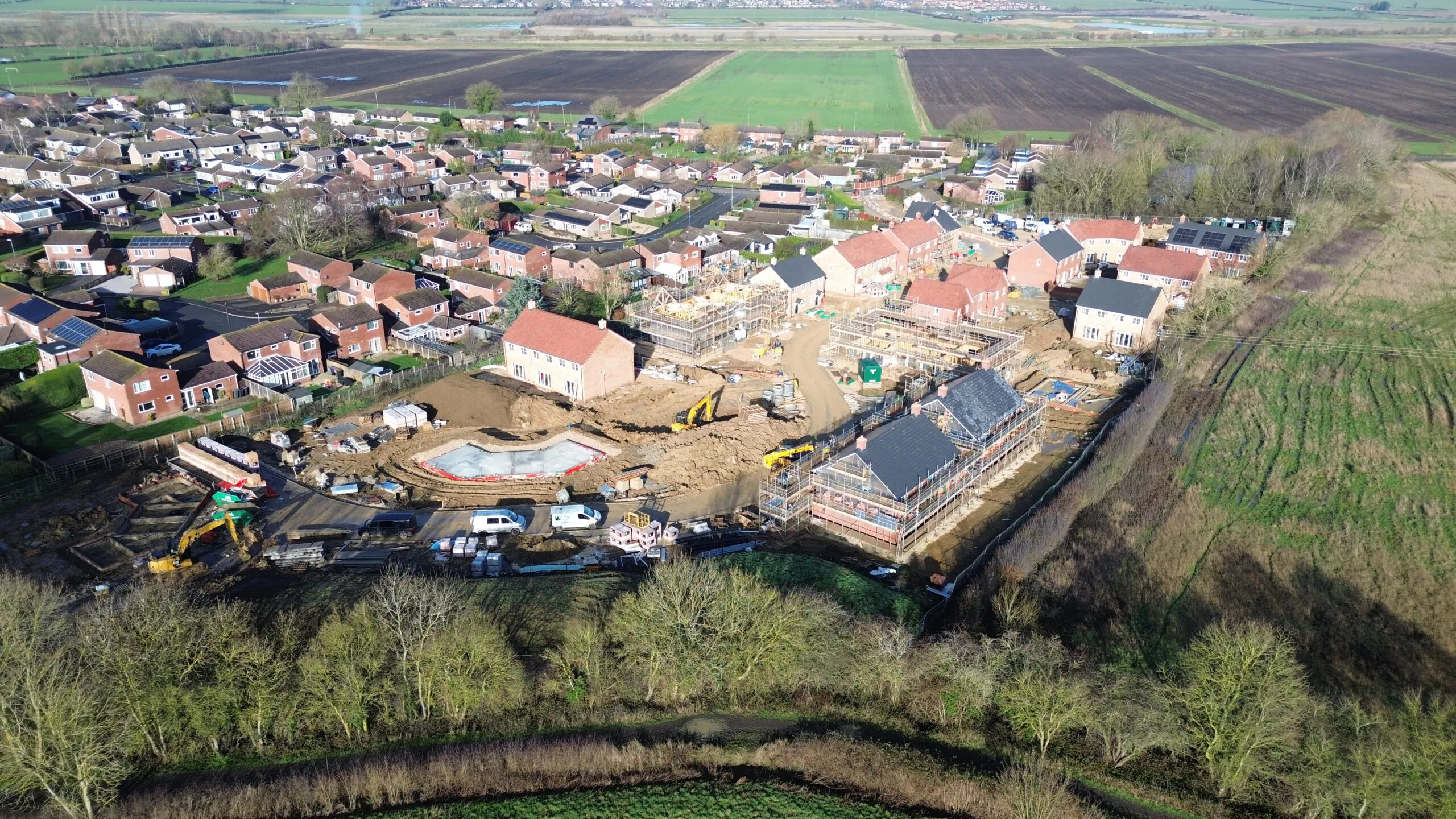 Aerial view of Beacon Hollow construction site beside existing homes and open countryside | Lafford Group