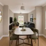 CGI of The Heckingon dining area looking through to the living room, with a four-seat table, wall-mounted television, sofa, armchair and French doors to the garden.