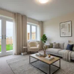 Living room CGI for The Waltham two-bedroom semi-detached home with patio doors, neutral décor and garden view.