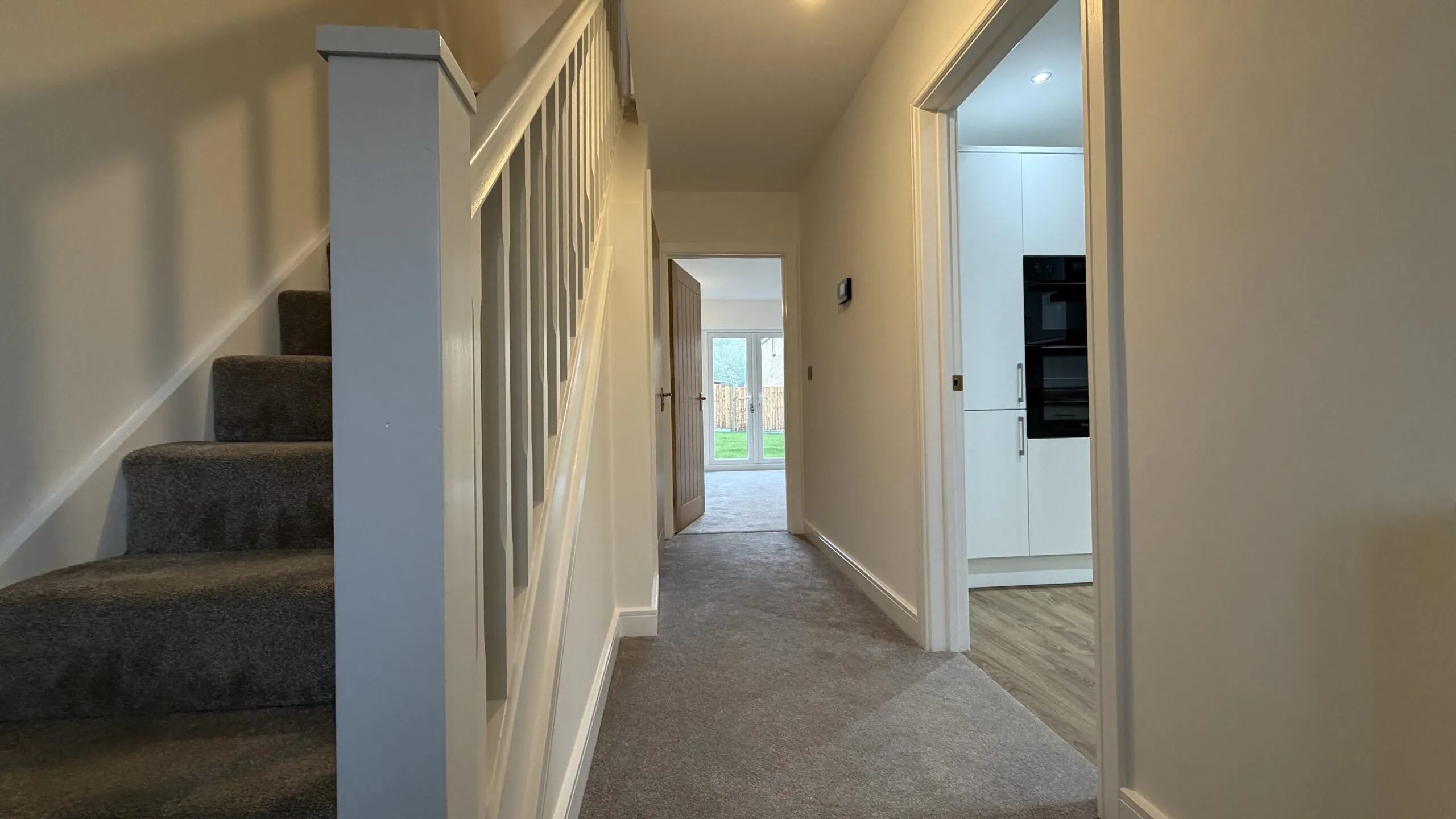 Entrance hall with staircase in The Ruskington, Plot 48 at Beacon Hollow.