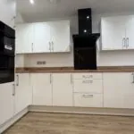 Contemporary kitchen with integrated AEG appliances in The Ruskington, Plot 48 at Beacon Hollow.