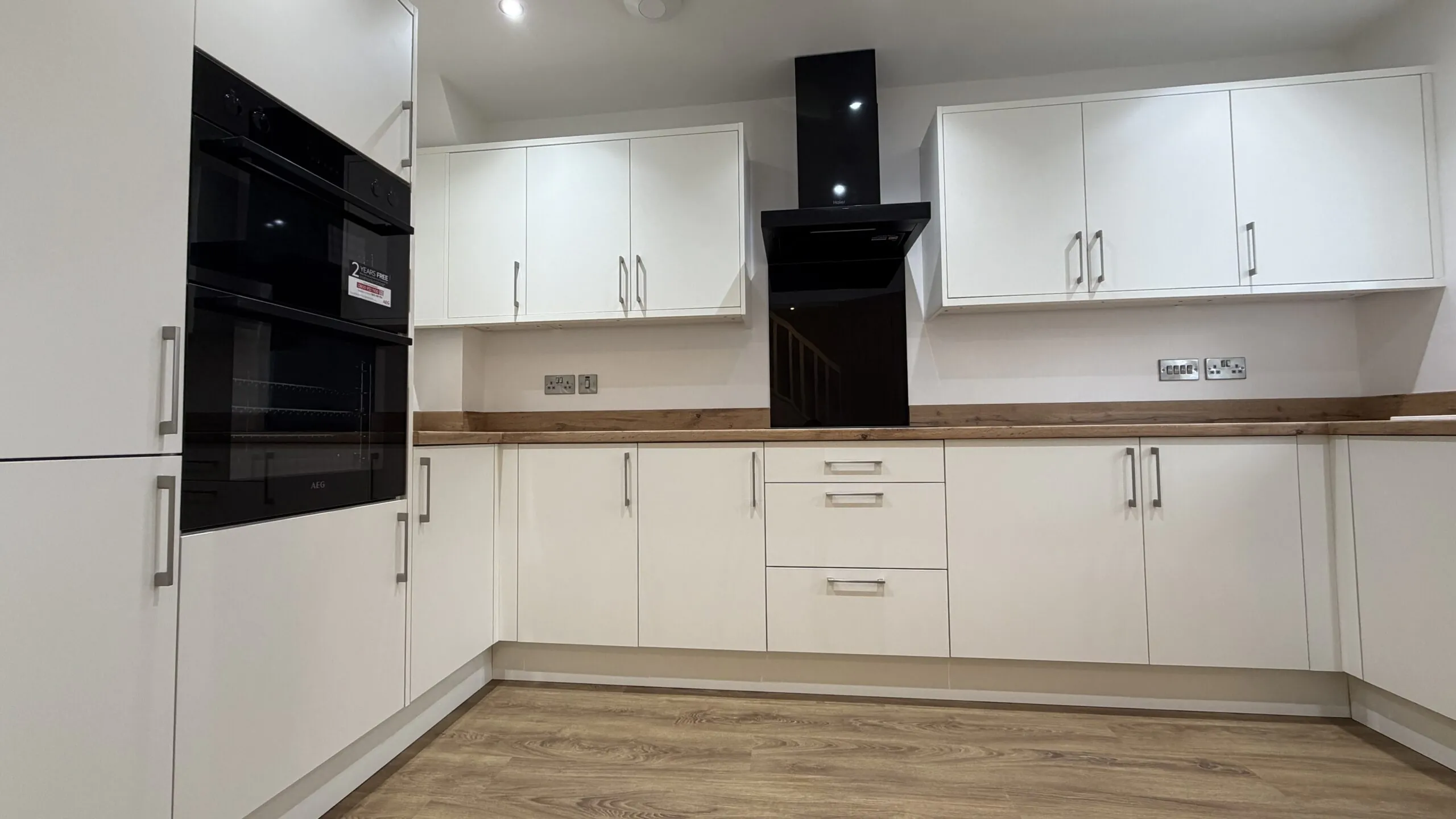 Contemporary kitchen with integrated AEG appliances in The Ruskington, Plot 48 at Beacon Hollow.