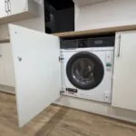 Kitchen showing integrated AEG washer dryer location in The Ruskington, Plot 48 at Beacon Hollow.
