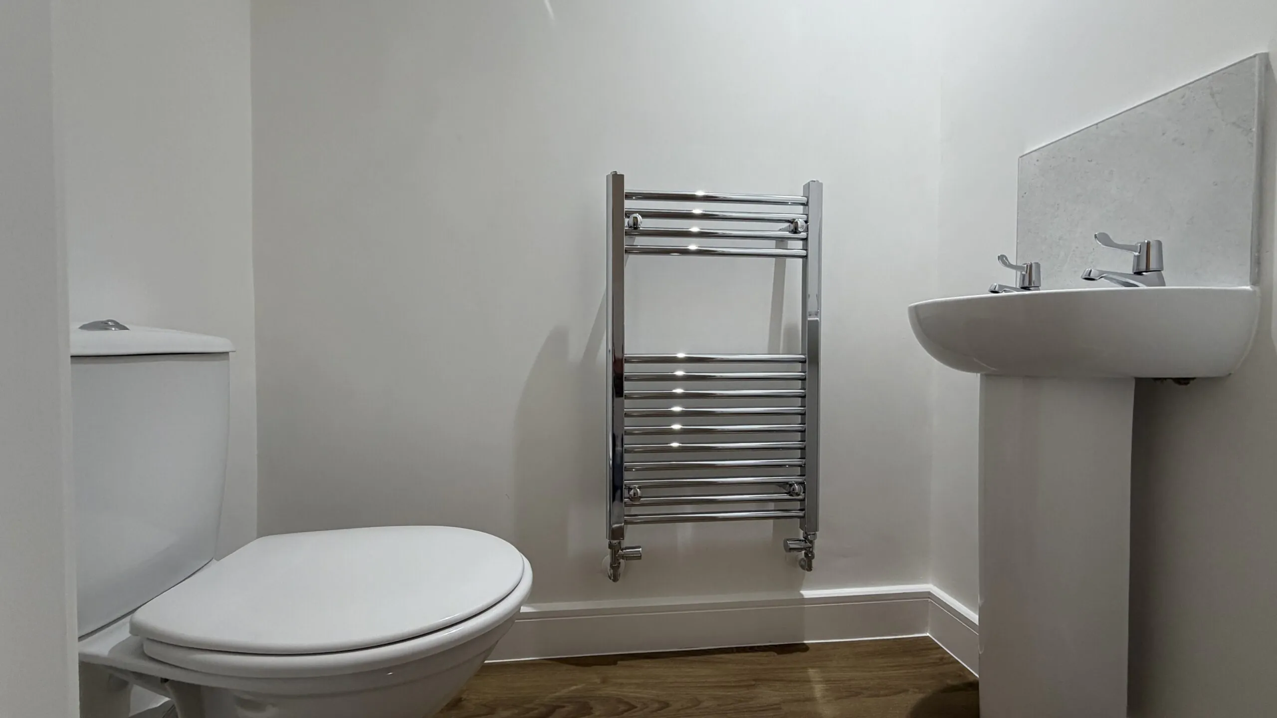 Ground floor WC with heated towel rail in The Ruskington, Plot 48 at Beacon Hollow