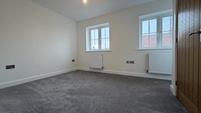 Main bedroom with dual windows in The Ruskington, Plot 48 at Beacon Hollow