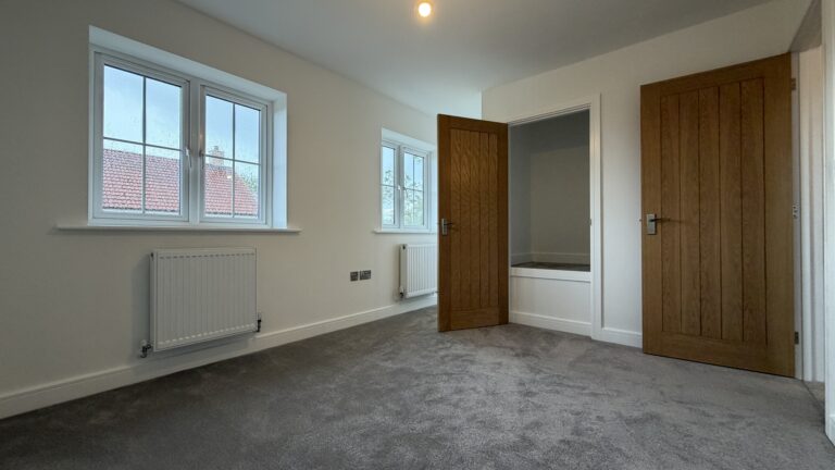 Bedroom 2 with built-in storage cupboard in The Ruskington, Plot 48 at Beacon Hollow