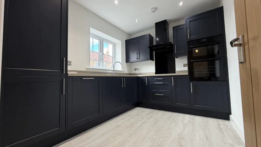 Contemporary kitchen with integrated AEG appliances in The Bardney, Plot 45 at Beacon Hollow.