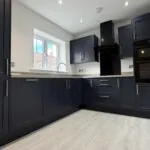 Contemporary kitchen with integrated AEG appliances in The Bardney, Plot 45 at Beacon Hollow.