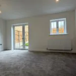Spacious living room with French doors to garden in The Bardney, Plot 45 at Beacon Hollow.