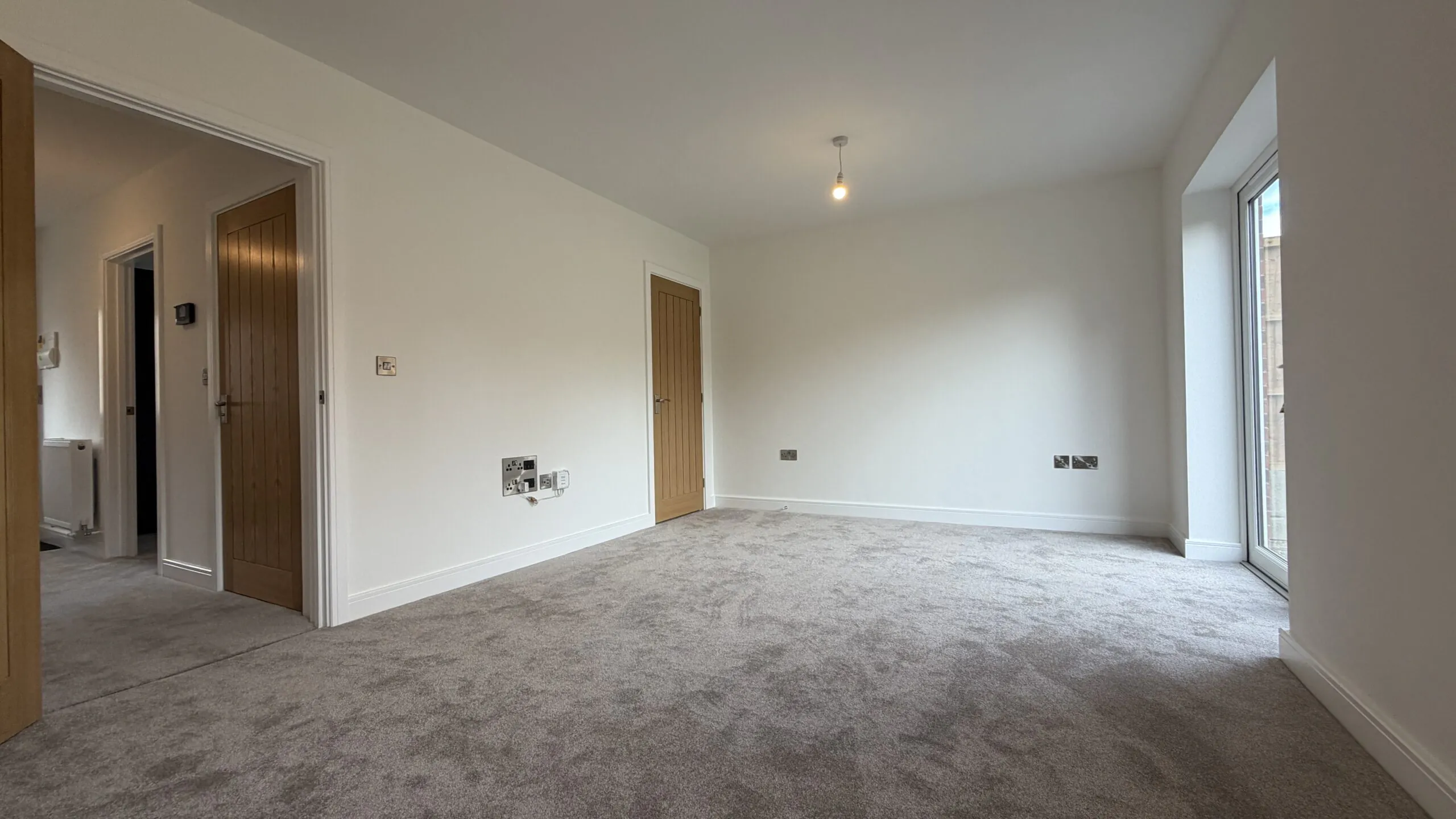 Living room with media connection points in The Bardney, Plot 45 at Beacon Hollow.