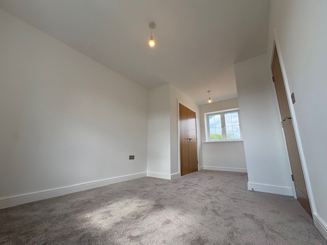 Principal bedroom with adjoining dressing area at Plot 2 The Crowland, Beacon Hollow, Washingborough.