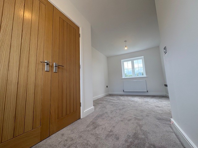 Principal bedroom with adjoining dressing area at Plot 2 The Crowland, Beacon Hollow, Washingborough